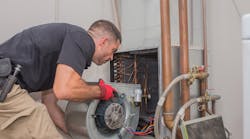 Technician With Air Handler Blower Motor Maintenance