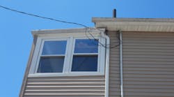 improper electrical installation neat roof of residential building